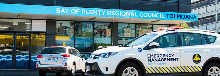 Civil Defence car in front of building