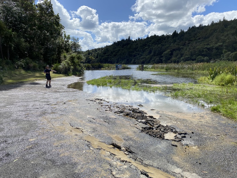Person standing by a river